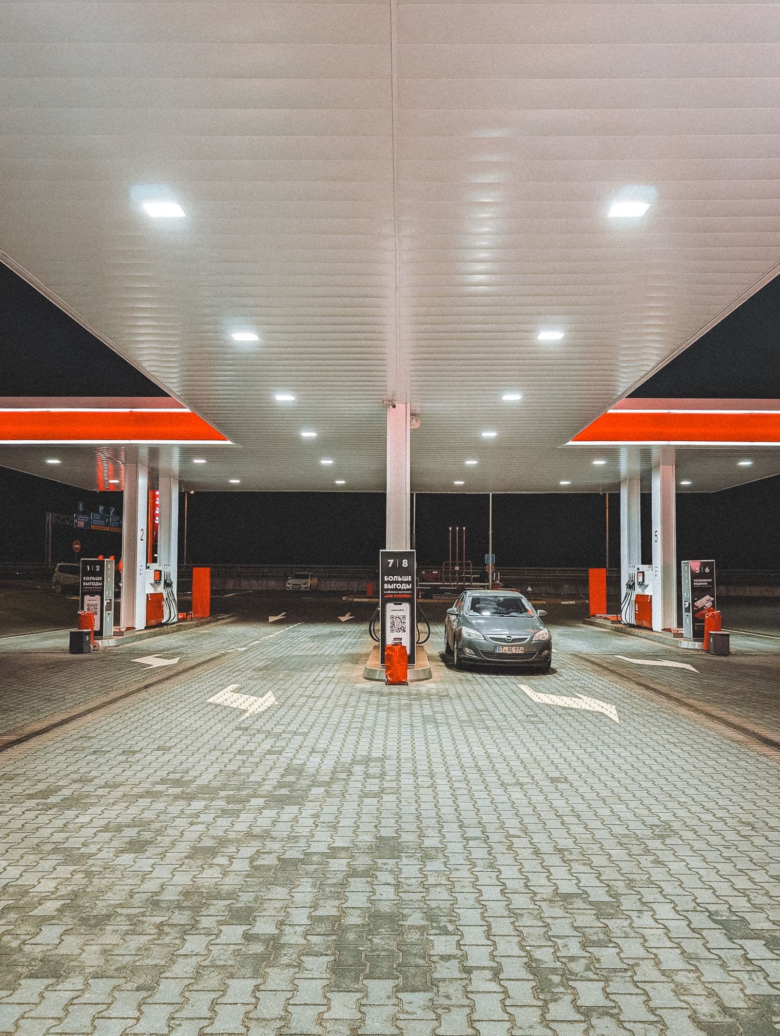 Fuel station forecourt with price display