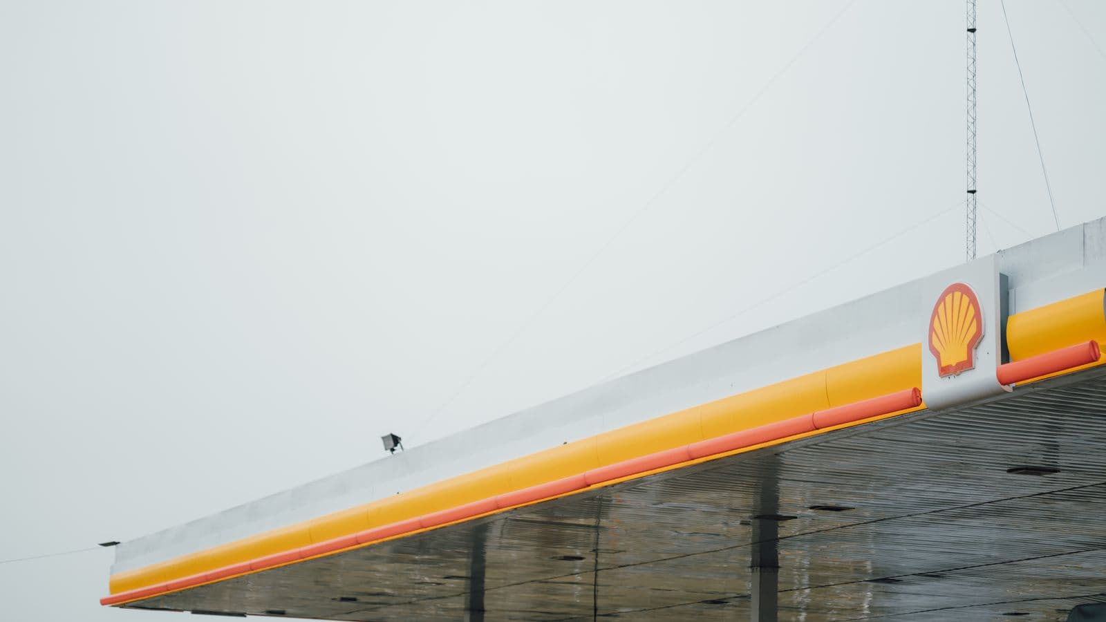 Row of fuel pumps at a service station forecourt