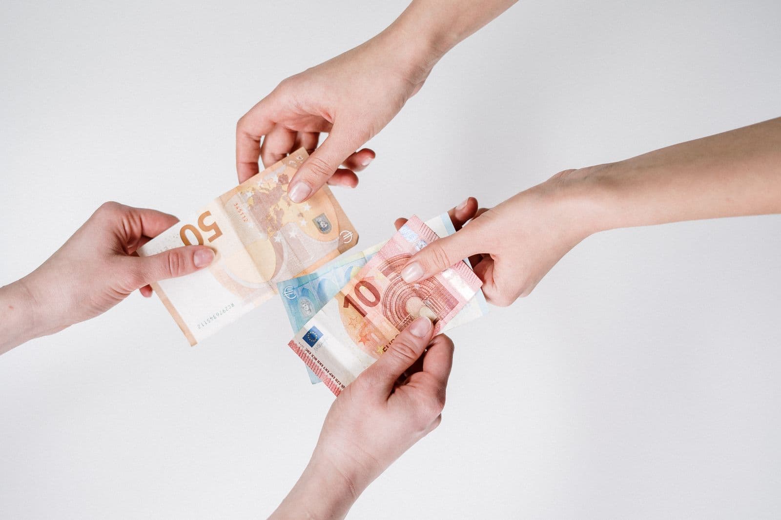 Euro banknotes and coins representing fuel taxes